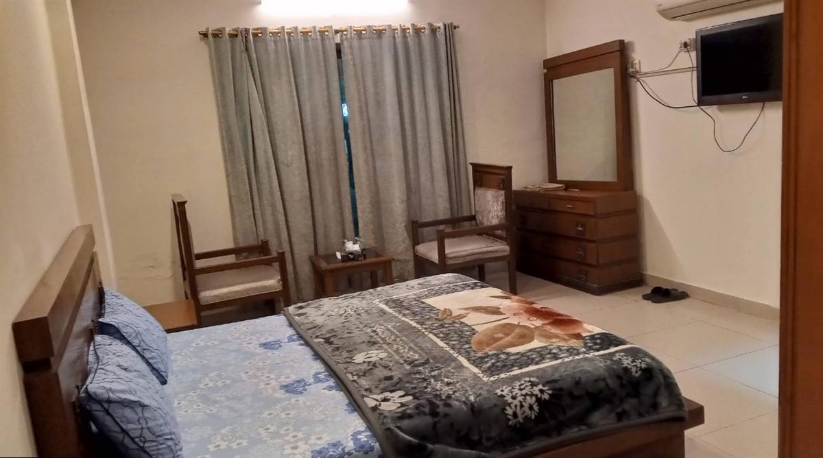 Comfortable hotel room with bed and modern amenities